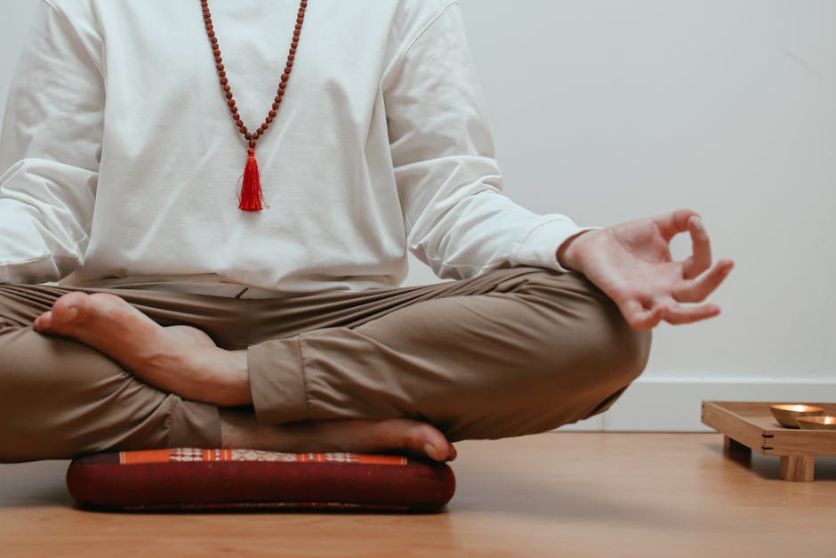 Close up of hands in a meditative mudra gesture